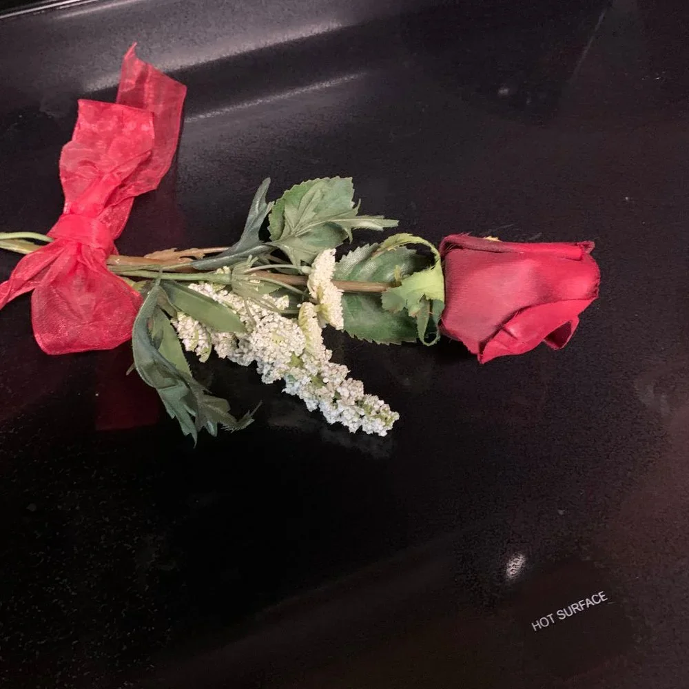 One Red rose with baby's breath and bow